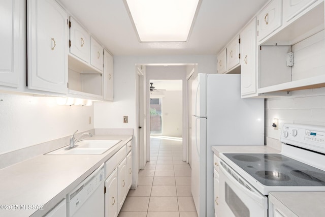 kitchen featuring white cabinetry, sink, light tile patterned floors, ceiling fan, and white appliances