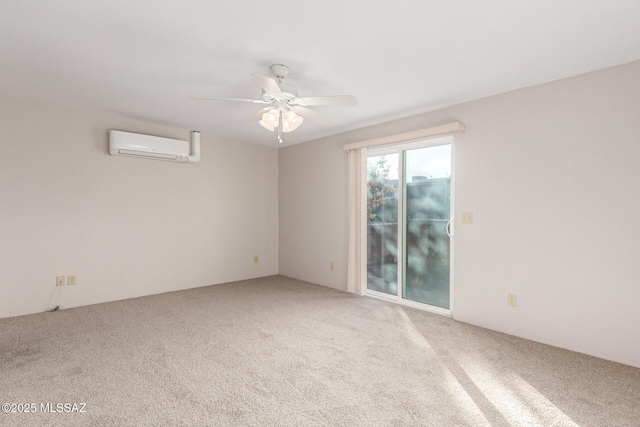 carpeted spare room with a wall mounted AC and ceiling fan