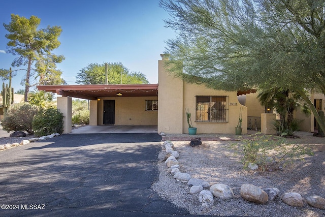 view of front of home with a carport