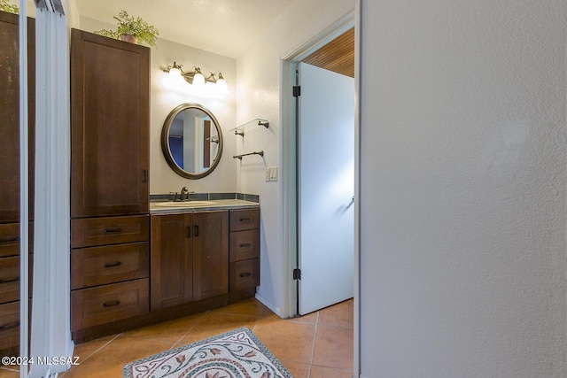 bathroom featuring tile patterned floors and vanity