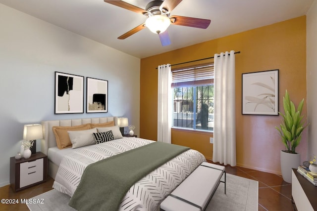 bedroom featuring ceiling fan and dark tile patterned floors