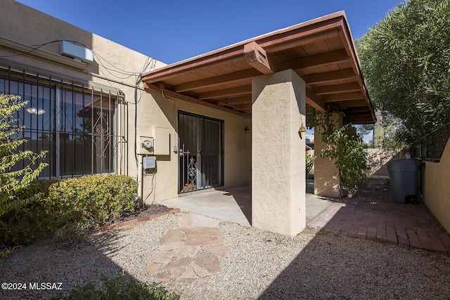 property entrance with a patio area