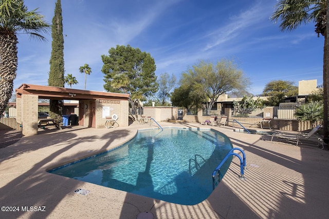 view of swimming pool with a patio area