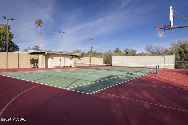 view of tennis court featuring basketball court