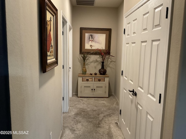 corridor with light colored carpet