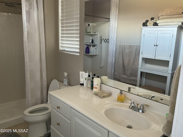 bathroom with walk in shower, toilet, tile patterned floors, and vanity