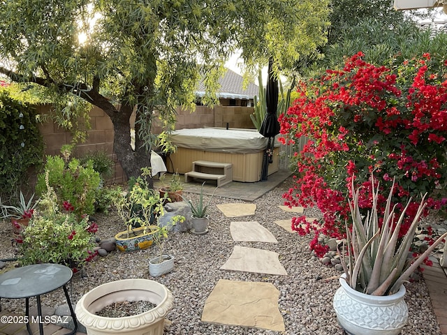 view of yard featuring a patio area and a hot tub