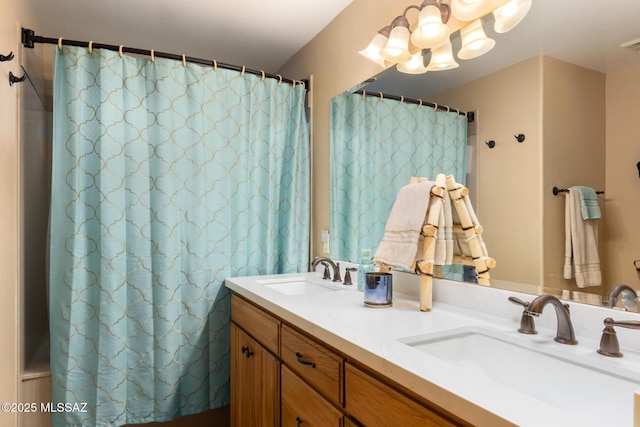 bathroom featuring a shower with curtain and vanity