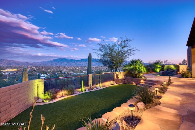 yard at dusk with a mountain view