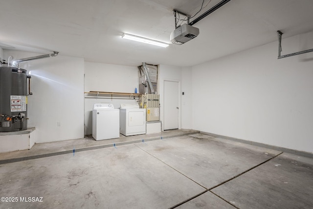 garage featuring a garage door opener, gas water heater, and independent washer and dryer