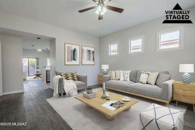 living room featuring ceiling fan and dark hardwood / wood-style floors