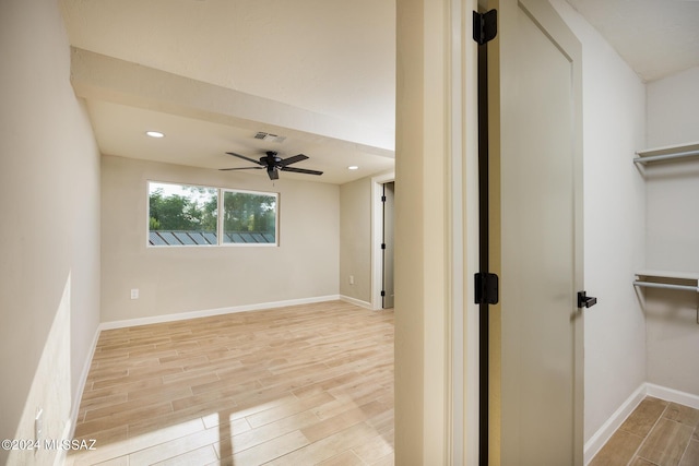 interior space with ceiling fan and light hardwood / wood-style floors