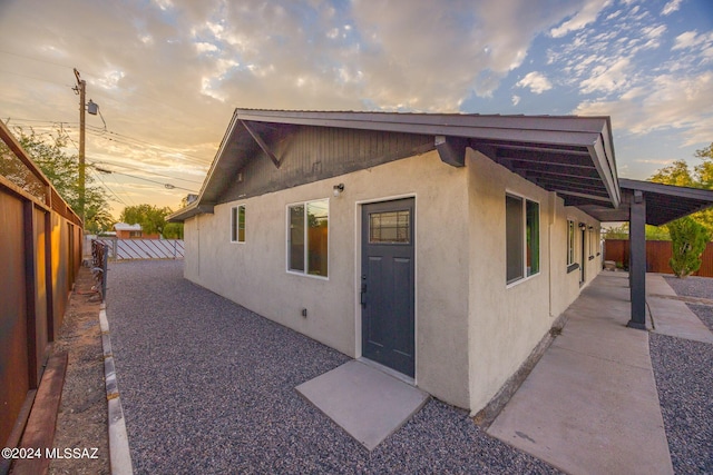 view of property exterior at dusk