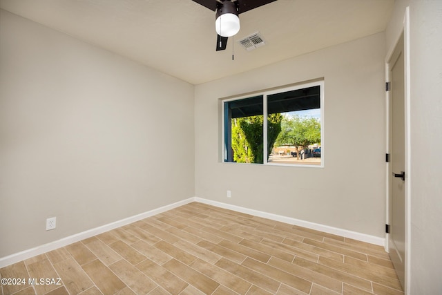 unfurnished room featuring light hardwood / wood-style flooring and ceiling fan