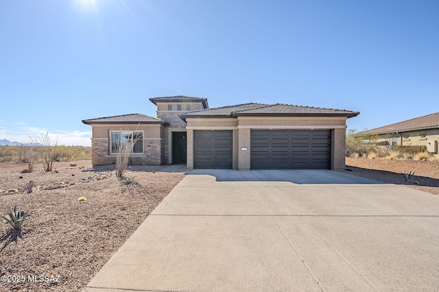 prairie-style house featuring a garage