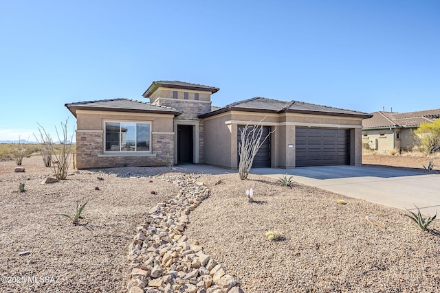 prairie-style house featuring a garage