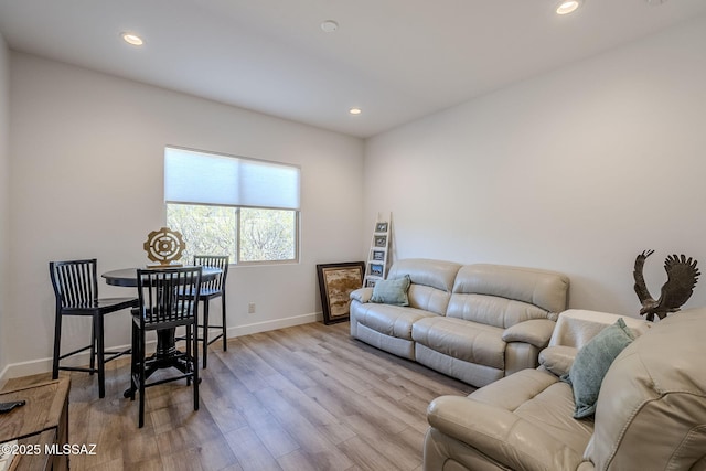 living room with light hardwood / wood-style flooring