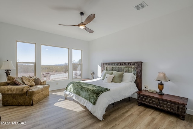 bedroom with ceiling fan and light hardwood / wood-style flooring