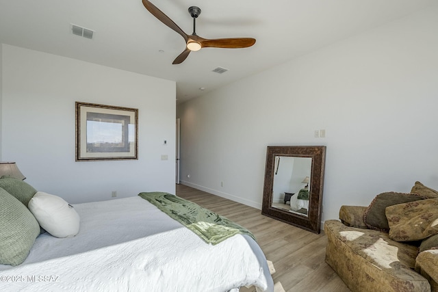 bedroom with ceiling fan and light hardwood / wood-style floors