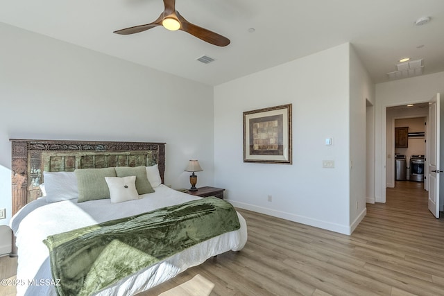 bedroom with ceiling fan and light hardwood / wood-style floors