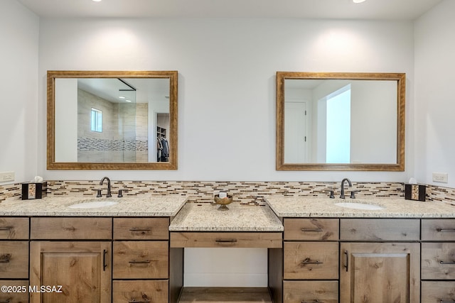 bathroom featuring tasteful backsplash and vanity