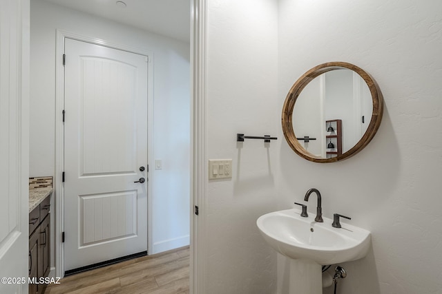 bathroom featuring sink and hardwood / wood-style floors