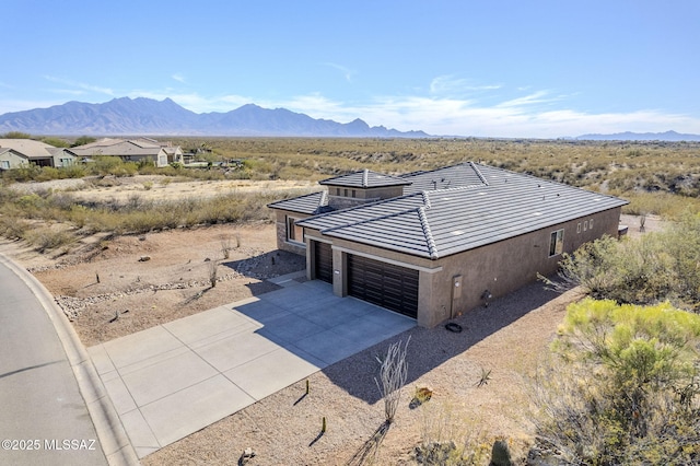 birds eye view of property with a mountain view