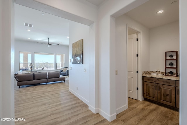 hallway featuring light hardwood / wood-style flooring