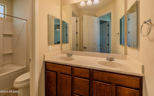 full bathroom featuring tile patterned floors, vanity, toilet, and washtub / shower combination