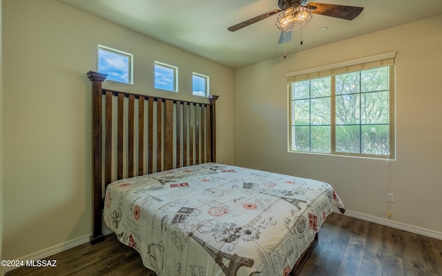 bedroom featuring dark hardwood / wood-style flooring and ceiling fan