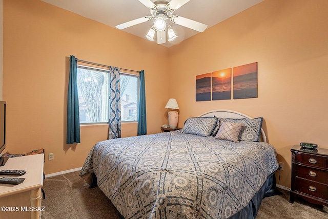 bedroom featuring dark colored carpet and ceiling fan