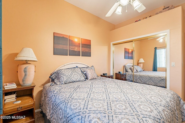 bedroom featuring ceiling fan and a closet