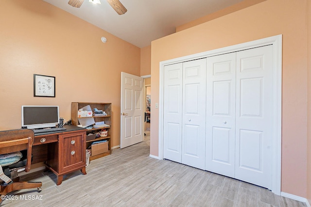 office area with light hardwood / wood-style floors and ceiling fan