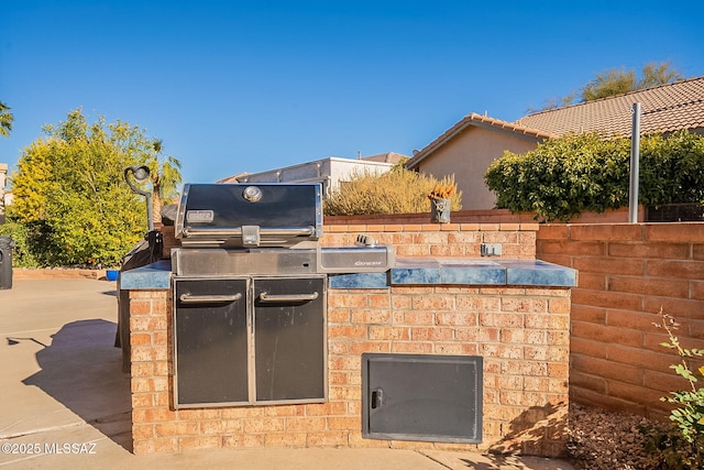 view of patio featuring exterior kitchen