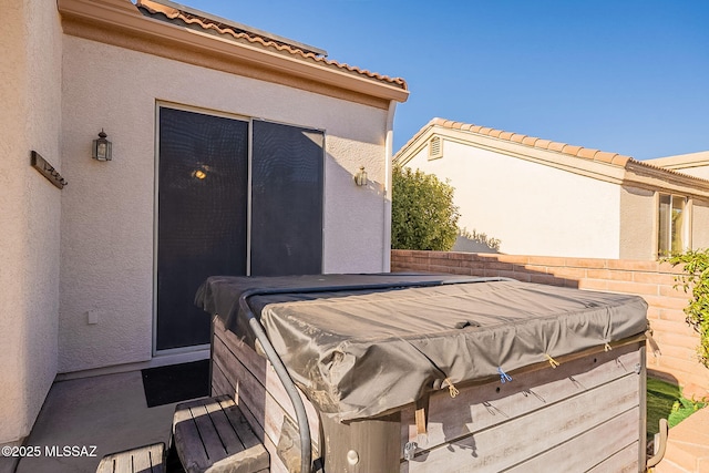 view of patio featuring a hot tub