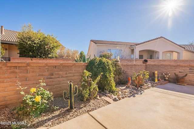 view of property exterior featuring a patio