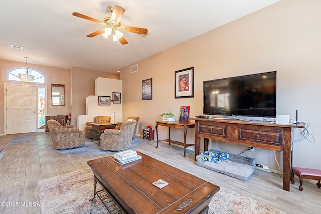 living room featuring light wood-type flooring and ceiling fan