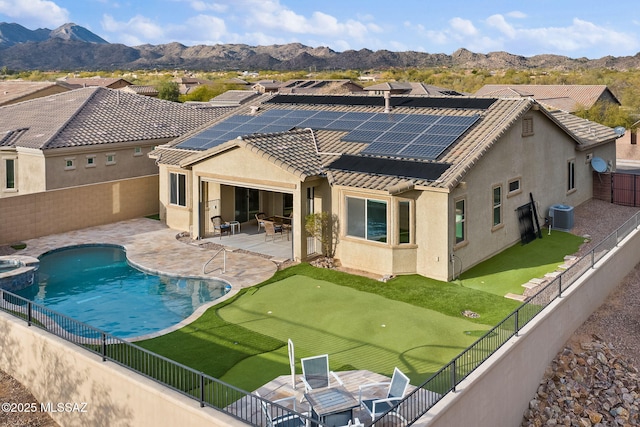 view of pool with a mountain view, a patio, and central AC