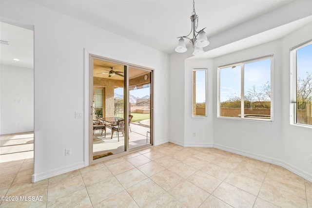 tiled empty room featuring ceiling fan with notable chandelier