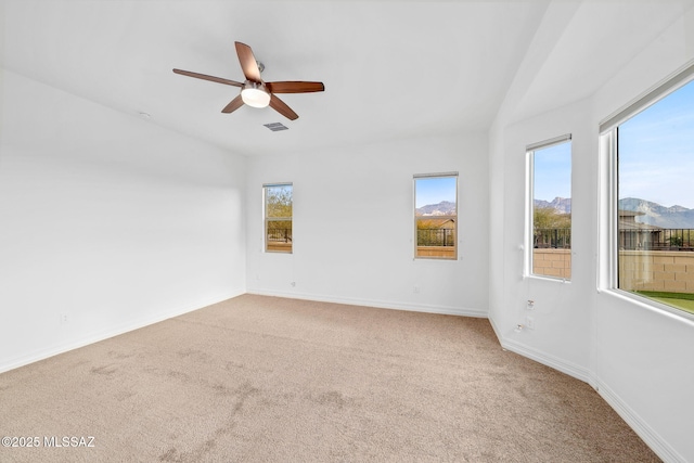 empty room with carpet floors and ceiling fan