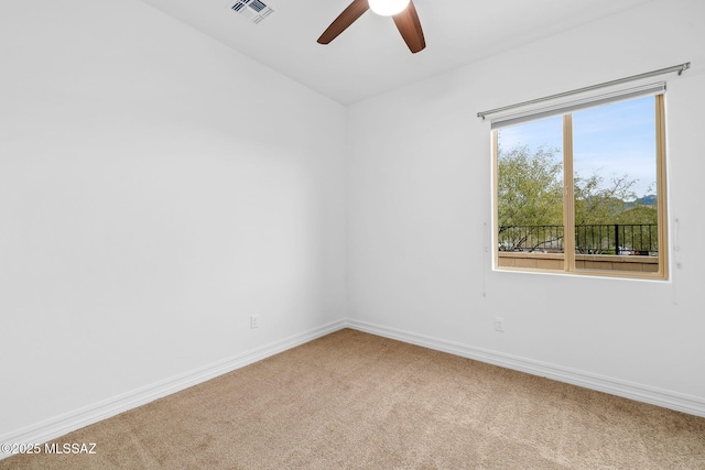 unfurnished room featuring ceiling fan and carpet floors