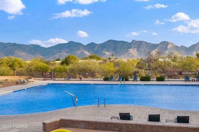 view of swimming pool featuring a mountain view