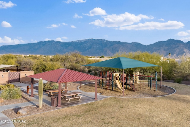 view of playground with a mountain view