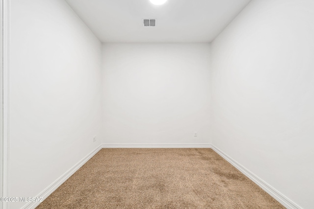 unfurnished room featuring carpet flooring