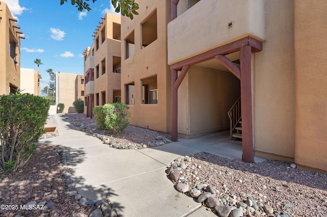 view of side of property featuring stucco siding