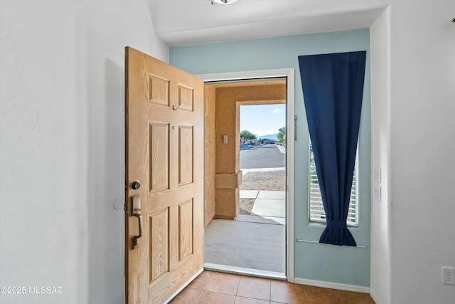 entryway featuring light tile patterned flooring