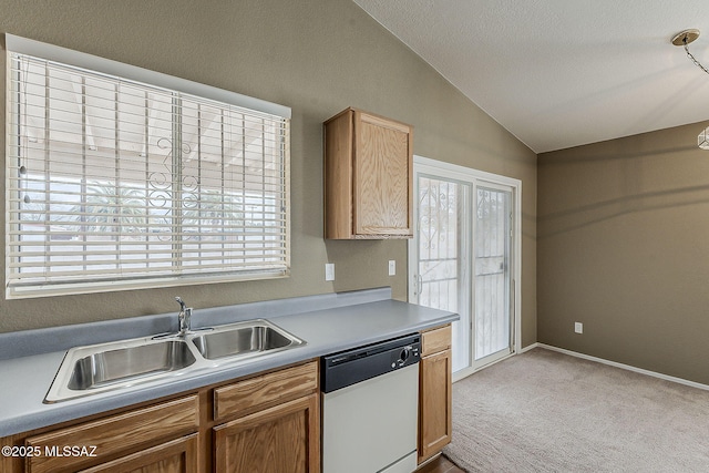 kitchen with light carpet, a sink, vaulted ceiling, light countertops, and dishwasher