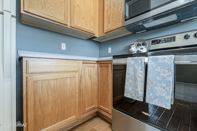 kitchen featuring appliances with stainless steel finishes and light countertops