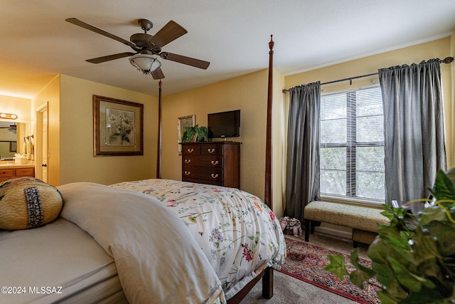 bedroom with carpet flooring, ceiling fan, and ensuite bath