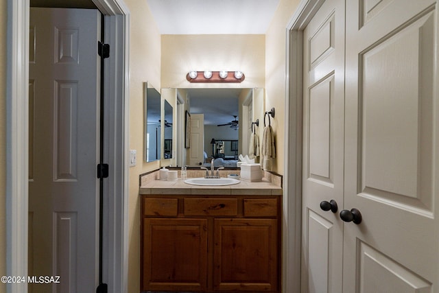 bathroom featuring ceiling fan and vanity